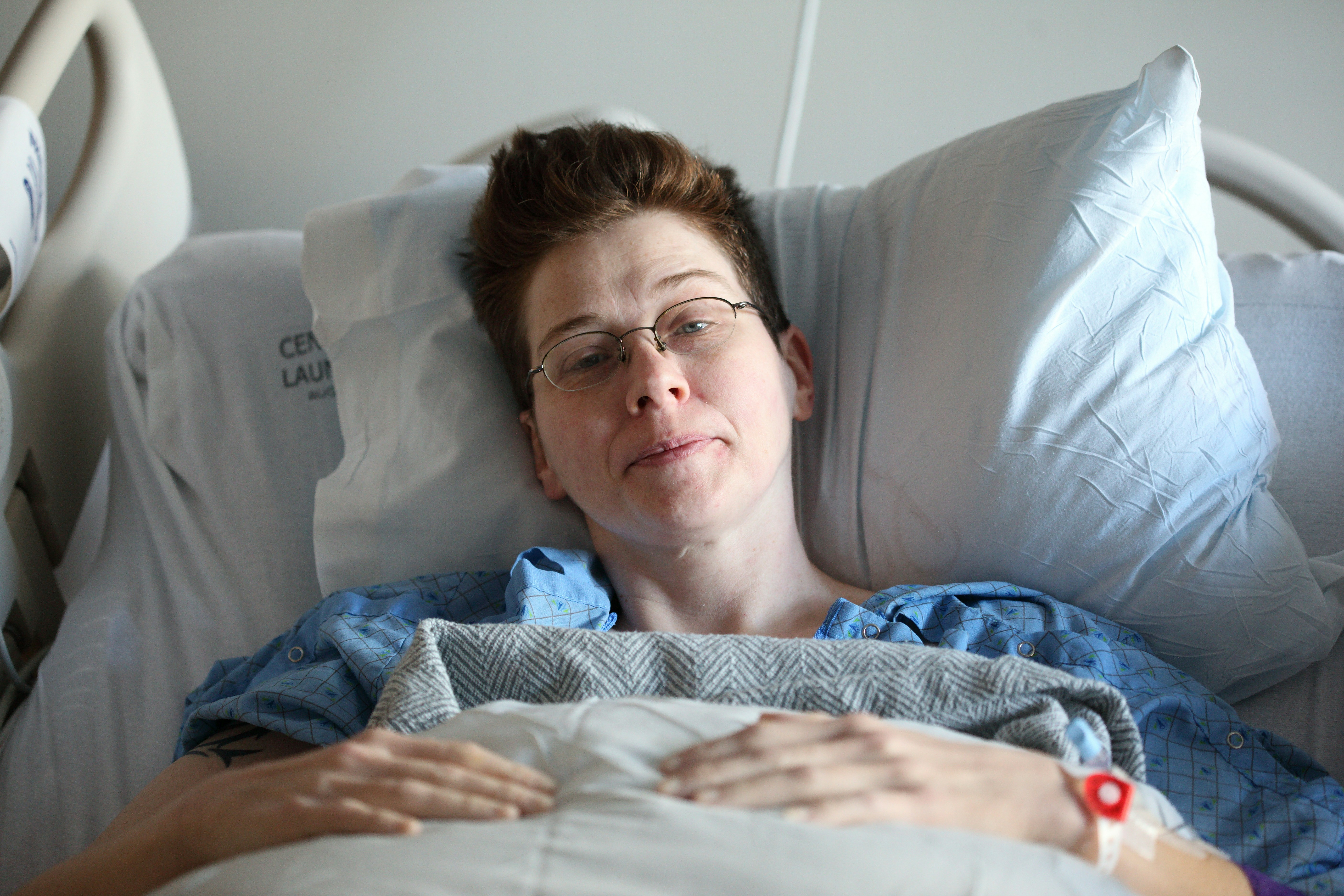 A person lying on a medical bed